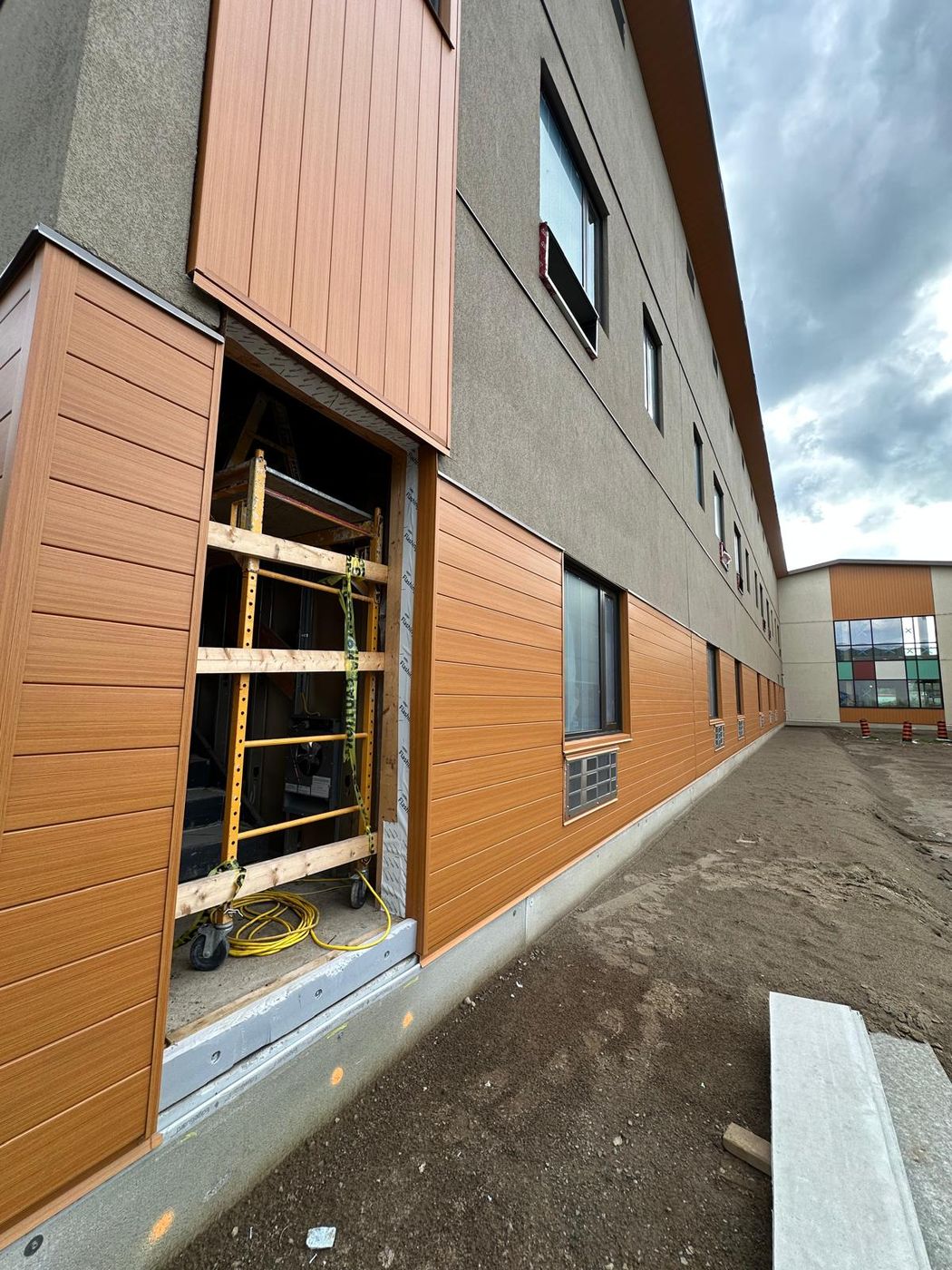 Close-up of cladding installation with flashing and sub-framing
